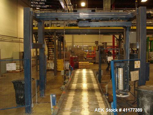 Used Cousins Automatic Stretch Wrapper, Model 7100-65-OHA. The Series 7100 fully automatic conveyorized overhead spiral stretch wrap systems will wrap up to 95 loads per hour, maximum load size 50” w...