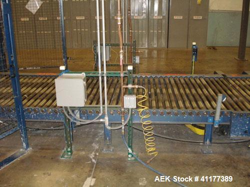 Used Cousins Automatic Stretch Wrapper, Model 7100-65-OHA. The Series 7100 fully automatic conveyorized overhead spiral stretch wrap systems will wrap up to 95 loads per hour, maximum load size 50” w...
