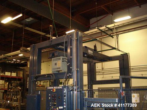 Used Cousins Automatic Stretch Wrapper, Model 7100-65-OHA. The Series 7100 fully automatic conveyorized overhead spiral stretch wrap systems will wrap up to 95 loads per hour, maximum load size 50” w...