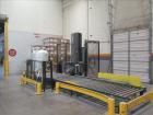 Used Lantech Stretch Wrapper, Model Q1000 Serial # QA 002180.  Automatic operation with powered infeed and discharge pallet conveyors, 18