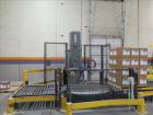 Used Lantech Stretch Wrapper, Model Q1000 Serial # QA 002180.  Automatic operation with powered infeed and discharge pallet conveyors, 18