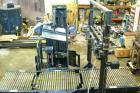 USED: Lantech stretch wrapper, series converted, products model SHASP.               Unit complete with Allen Bradley PLC, 10' powered chain driven live roller conveyor, auto stretch wrapping complet...