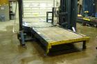 USED: Lantech stretch wrapper, series converted, products model SHASP.               Unit complete with Allen Bradley PLC, 10' powered chain driven live roller conveyor, auto stretch wrapping complet...