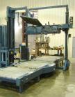 USED: Lantech stretch wrapper, series converted, products model SHASP.               Unit complete with Allen Bradley PLC, 10' powered chain driven live roller conveyor, auto stretch wrapping complet...