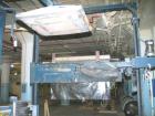 USED: Lantech stretch wrapper, series converted, products model SHASP.               Unit complete with Allen Bradley PLC, 10' powered chain driven live roller conveyor, auto stretch wrapping complet...