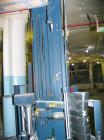 USED: Lantech stretch wrapper, series converted, products model SHASP.               Unit complete with Allen Bradley PLC, 10' powered chain driven live roller conveyor, auto stretch wrapping complet...