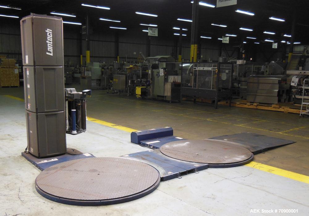 Used Lantech Q300 Semi-Automatic Dual truntable stretch wrapper. Low Profile unit capable of speeds from 25-35 loads per hour. Maximum load size 73 1/2", height 80", weight 4000 pounds. Has (2) 65" d...