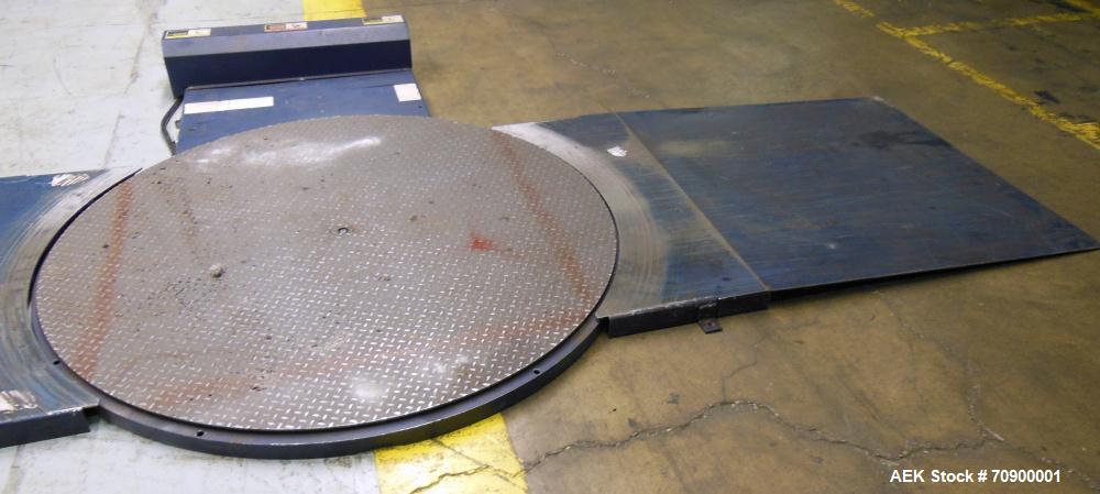 Used Lantech Q300 Semi-Automatic Dual truntable stretch wrapper. Low Profile unit capable of speeds from 25-35 loads per hour. Maximum load size 73 1/2", height 80", weight 4000 pounds. Has (2) 65" d...