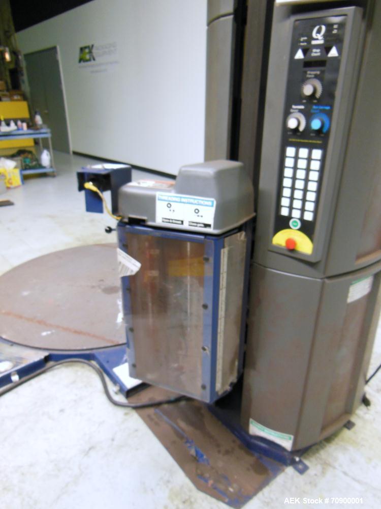 Used Lantech Q300 Semi-Automatic Dual truntable stretch wrapper. Low Profile unit capable of speeds from 25-35 loads per hour. Maximum load size 73 1/2", height 80", weight 4000 pounds. Has (2) 65" d...
