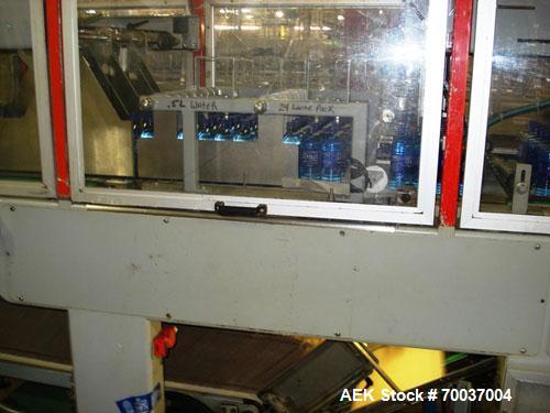 Used CERMEX Tray/Pad Shrinkwrapper, Model TSP70. Integrated tray/shrink machine capable of applying registered film at speeds up to 30 trays per minute on 12 and 24 packs. Includes Nordson 3400 hot m...