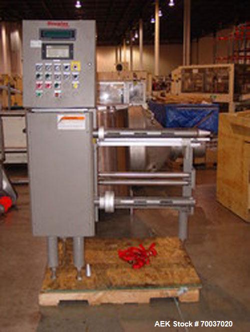 Used Douglas High Speed Bundler, Model MW7-1124 Multi Wrapper. Dual lane, 70 cycle/minute. 480 VAC, 60 hz. Machine has very low operating hours, approximately 200. Machine bundles 4 packs of 2.361" d...