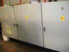 Used CERMEX Tray/Pad Shrinkwrapper, Model TSP70. Integrated tray/shrink machine capable of applying registered film at speeds up to 30 trays per minute on 12 and 24 packs. Includes Nordson 3400 hot m...