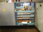 Used CERMEX Tray/Pad Shrinkwrapper, Model TSP70. Integrated tray/shrink machine capable of applying registered film at speeds up to 30 trays per minute on 12 and 24 packs. Includes Nordson 3400 hot m...