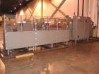 Used Douglas High Speed Bundler, Model MW7-1124 Multi Wrapper. Dual lane, 70 cycle/minute. 480 VAC, 60 hz. Machine has very low operating hours, approximately 200. Machine bundles 4 packs of 2.361