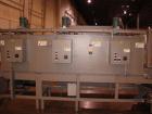 Used Douglas High Speed Bundler, Model MW7-1124 Multi Wrapper. Dual lane, 70 cycle/minute. 480 VAC, 60 hz. Machine has very low operating hours, approximately 200. Machine bundles 4 packs of 2.361