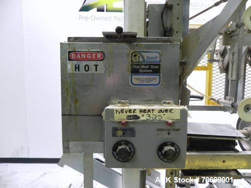 Used SWF Model 1T4 Glue Tray Former with Lidder. Glue tray former capable of speeds up to 35 trays per minute depending on case size. Has vacuum blank tray pick up. Has a tray size range: 7" to 34" l...