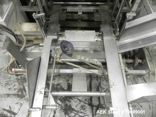 Used SWF Model 1T4 Glue Tray Former with Lidder. Glue tray former capable of speeds up to 35 trays per minute depending on case size. Has vacuum blank tray pick up. Has a tray size range: 7" to 34" l...