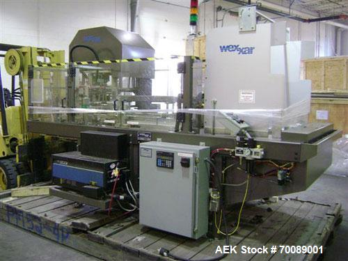 Used Wexxar Tray Former, model Delta 3. Nordson 3700 "Vista" hot glue applicator, 15 lb tomato tray format, easy load magazine, machine management system with tri-lite beacon, manufactured 2002.