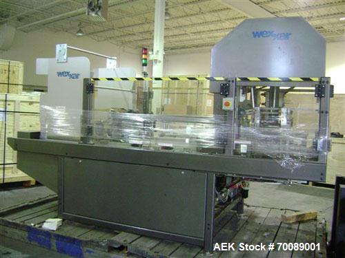 Used Wexxar Tray Former, model Delta 3. Nordson 3700 "Vista" hot glue applicator, 15 lb tomato tray format, easy load magazine, machine management system with tri-lite beacon, manufactured 2002.