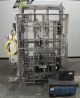 Used SWF Model 1T4 Trayformer. Stainless steel frame capable of speeds up to 35 trays per miniute depending on case size.Has a tray size range:7
