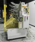 Used SWF Model 1T4 Glue Tray Former with Lidder. Glue tray former capable of speeds up to 35 trays per minute depending on case size. Has vacuum blank tray pick up. Has a tray size range: 7