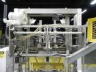 Used SWF Model 1T4 Glue Tray Former with Lidder. Glue tray former capable of speeds up to 35 trays per minute depending on case size. Has vacuum blank tray pick up. Has a tray size range: 7