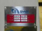 Used SWF Model 1T4 Glue Tray Former with Lidder. Glue tray former capable of speeds up to 35 trays per minute depending on case size. Has vacuum blank tray pick up. Has a tray size range: 7