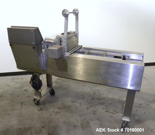 Used Ameripak Filled Tray Sealer, Model 145. Capable of speeds up to 30 trays per minute depending on tray size, material, and feeding capaility. Single parent roll, 3’’ I.D. core, maximum roll capac...