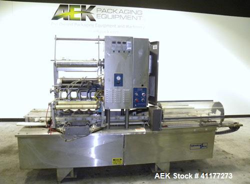 Used Holmatic CBS-18-4F Tamper Evident Inline Heat Sealer. Capable of speeds up to 160 cpm. Three seal head system last running rectangular container. Container range: diameter 1.5 to 5.5" or 38 - 12...