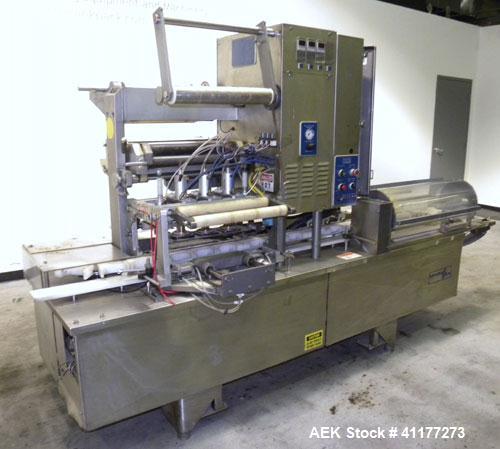 Used Holmatic CBS-18-4F Tamper Evident Inline Heat Sealer. Capable of speeds up to 160 cpm. Three seal head system last running rectangular container. Container range: diameter 1.5 to 5.5" or 38 - 12...