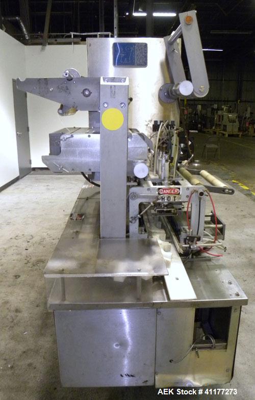 Used Holmatic CBS-18-4F Tamper Evident Inline Heat Sealer. Capable of speeds up to 160 cpm. Three seal head system last running rectangular container. Container range: diameter 1.5 to 5.5" or 38 - 12...