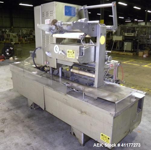 Used Holmatic CBS-18-4F Tamper Evident Inline Heat Sealer. Capable of speeds up to 160 cpm. Three seal head system last running rectangular container. Container range: diameter 1.5 to 5.5" or 38 - 12...