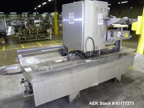 Used Holmatic CBS-18-4F Tamper Evident Inline Heat Sealer. Capable of speeds up to 160 cpm. Three seal head system last running rectangular container. Container range: diameter 1.5 to 5.5" or 38 - 12...