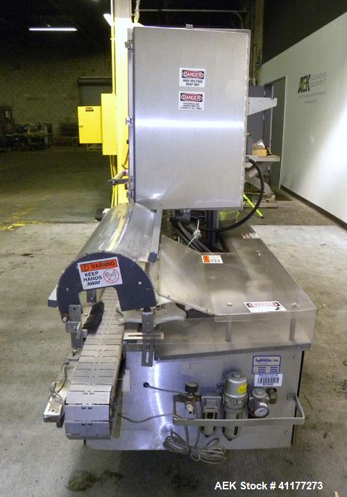 Used Holmatic CBS-18-4F Tamper Evident Inline Heat Sealer. Capable of speeds up to 160 cpm. Three seal head system last running rectangular container. Container range: diameter 1.5 to 5.5" or 38 - 12...