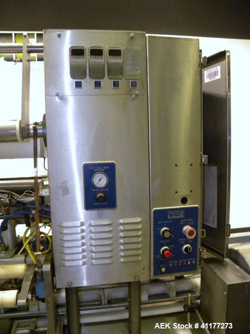 Used Holmatic CBS-18-4F Tamper Evident Inline Heat Sealer. Capable of speeds up to 160 cpm. Three seal head system last running rectangular container. Container range: diameter 1.5 to 5.5" or 38 - 12...