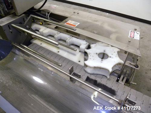 Used Holmatic CBS-18-4F Tamper Evident Inline Heat Sealer. Capable of speeds up to 160 cpm. Three seal head system last running rectangular container. Container range: diameter 1.5 to 5.5" or 38 - 12...