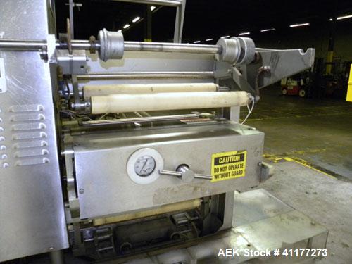 Used Holmatic CBS-18-4F Tamper Evident Inline Heat Sealer. Capable of speeds up to 160 cpm. Three seal head system last running rectangular container. Container range: diameter 1.5 to 5.5" or 38 - 12...
