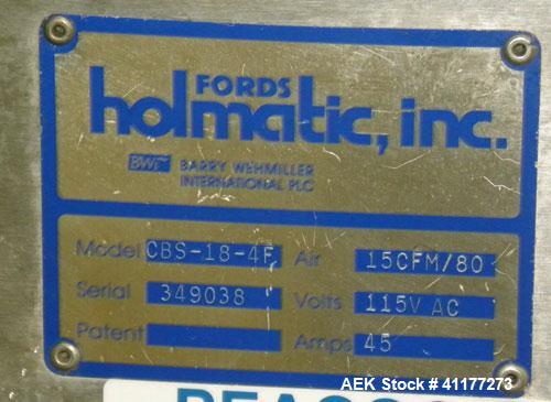 Used Holmatic CBS-18-4F Tamper Evident Inline Heat Sealer. Capable of speeds up to 160 cpm. Three seal head system last running rectangular container. Container range: diameter 1.5 to 5.5" or 38 - 12...