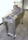 Used Ameripak Filled Tray Sealer, Model 145. Capable of speeds up to 30 trays per minute depending on tray size, material, and feeding capaility. Single parent roll, 3’’ I.D. core, maximum roll capac...