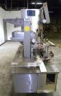 Used Holmatic CBS-18-4F Tamper Evident Inline Heat Sealer. Capable of speeds up to 160 cpm. Three seal head system last running rectangular container. Container range: diameter 1.5 to 5.5