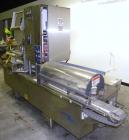Used Holmatic CBS-18-4F Tamper Evident Inline Heat Sealer. Capable of speeds up to 160 cpm. Three seal head system last running rectangular container. Container range: diameter 1.5 to 5.5