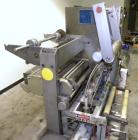Used Holmatic CBS-18-4F Tamper Evident Inline Heat Sealer. Capable of speeds up to 160 cpm. Three seal head system last running rectangular container. Container range: diameter 1.5 to 5.5