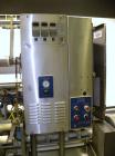 Used Holmatic CBS-18-4F Tamper Evident Inline Heat Sealer. Capable of speeds up to 160 cpm. Three seal head system last running rectangular container. Container range: diameter 1.5 to 5.5