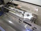 Used Holmatic CBS-18-4F Tamper Evident Inline Heat Sealer. Capable of speeds up to 160 cpm. Three seal head system last running rectangular container. Container range: diameter 1.5 to 5.5