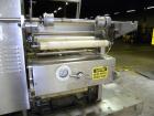 Used Holmatic CBS-18-4F Tamper Evident Inline Heat Sealer. Capable of speeds up to 160 cpm. Three seal head system last running rectangular container. Container range: diameter 1.5 to 5.5