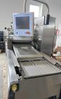 Used- Multivac Stainless Steel Automatic Food Tray Sealer, Model T-300. Capable of speeds from 12 - 30 packs per minute (6 -...