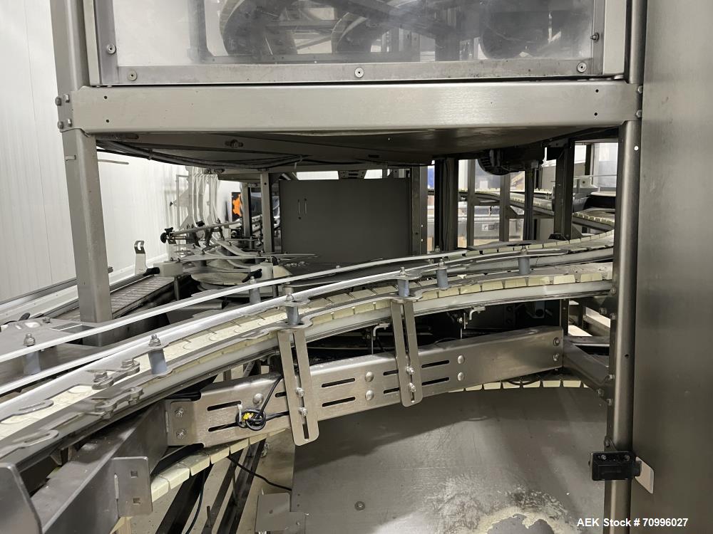 Used Used- Hartness Model Dynac 6400 Spiral First-In First-Out (FIFO) Accumulation Line for beverage containers.  Is capable of running products with a maximum product height range of 1"-11.75". 6 ti...