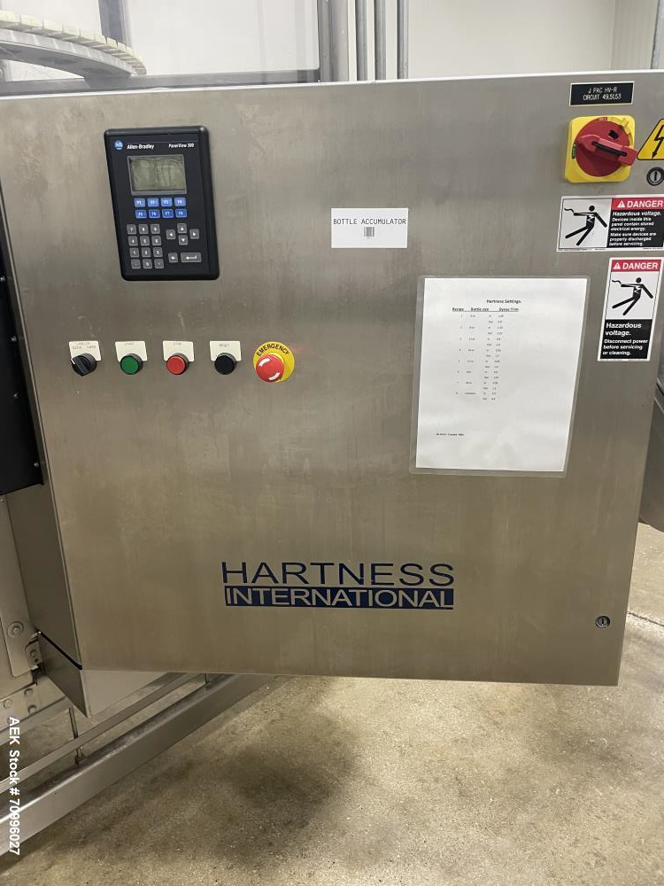 Used Used- Hartness Model Dynac 6400 Spiral First-In First-Out (FIFO) Accumulation Line for beverage containers.  Is capable of running products with a maximum product height range of 1"-11.75". 6 ti...