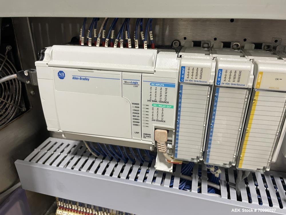 Used Used- Hartness Model Dynac 6400 Spiral First-In First-Out (FIFO) Accumulation Line for beverage containers.  Is capable of running products with a maximum product height range of 1"-11.75". 6 ti...