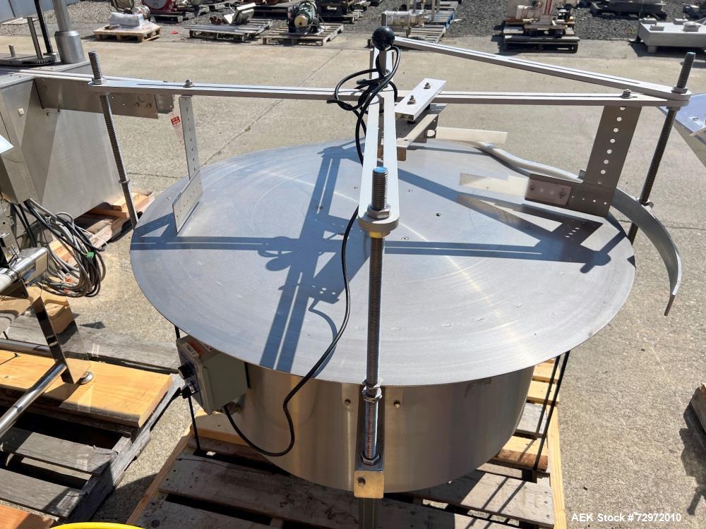 Used- PackWest 48" Diameter Stainless Steel Unscrambling Table, Model #48 UNSCRAMBLER. Includes guide rails and arm that are...